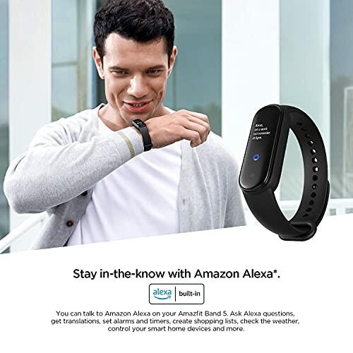 Man using Amazfit Band 5 smartwatch with Alexa built-in