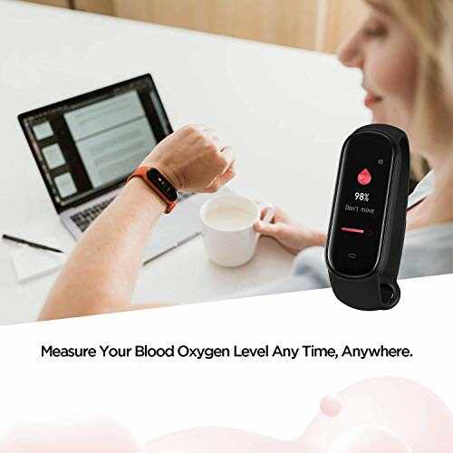 Person using a smartwatch to check blood oxygen level.