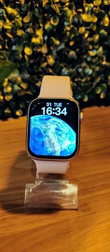 Smartwatch displaying earth image on a stand